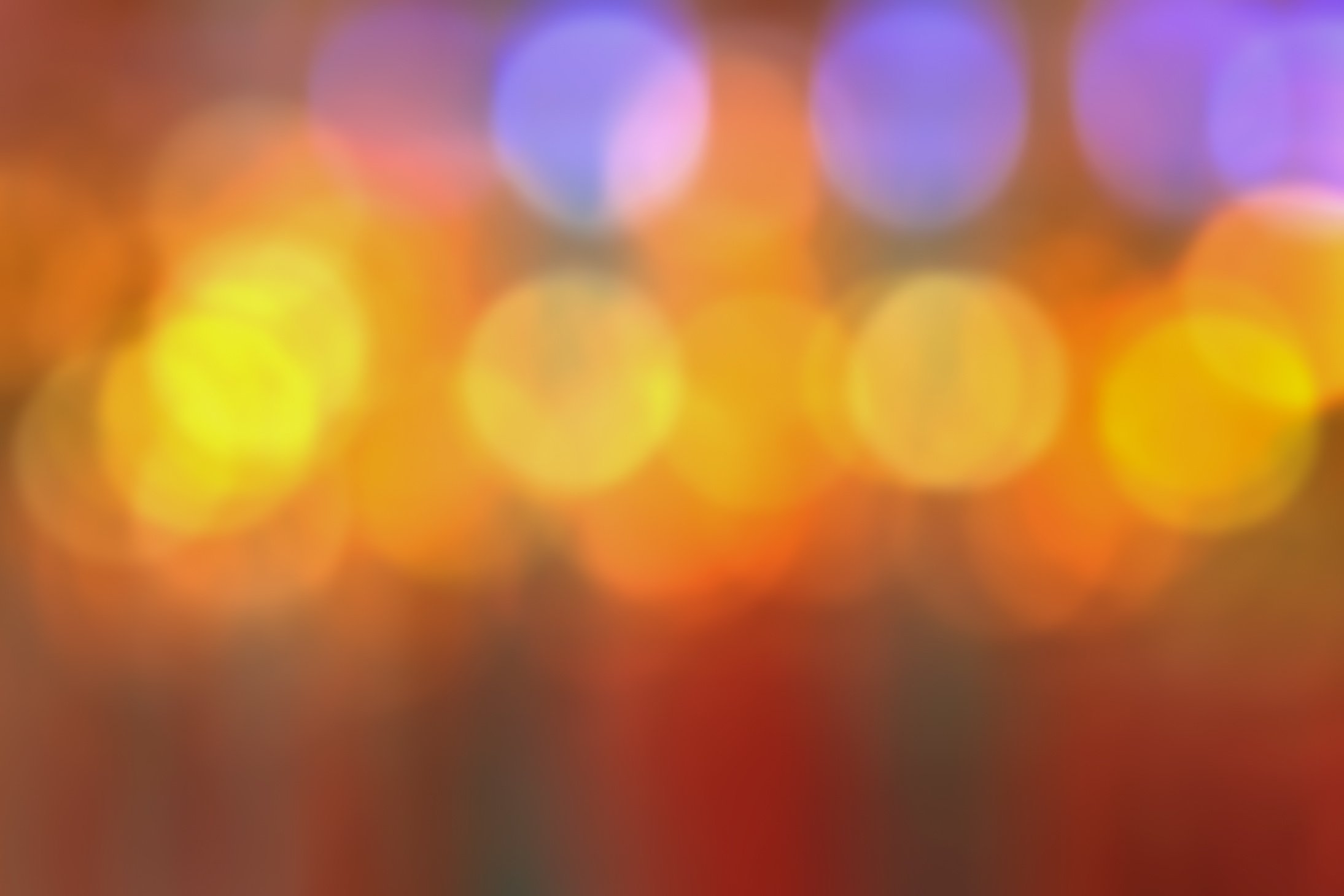 blurred red, gold, purple and orange bokeh or defocus background